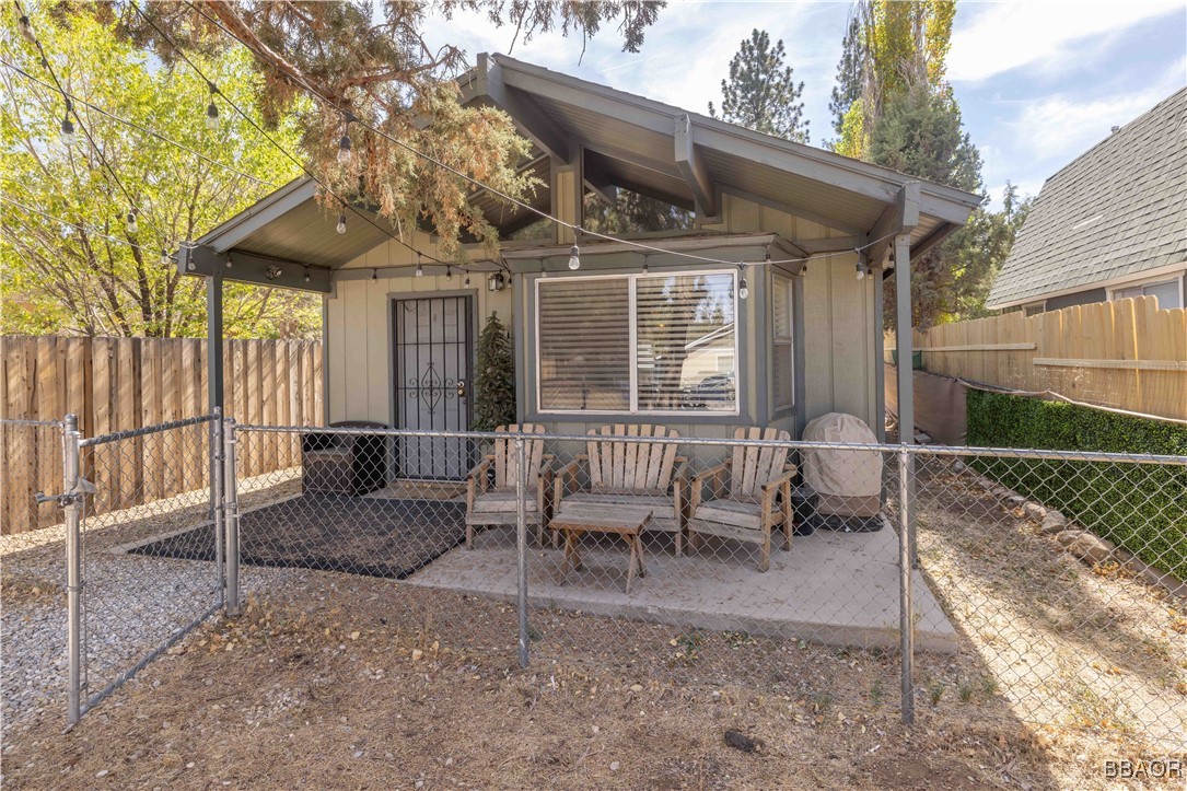 a porch with outdoor seating