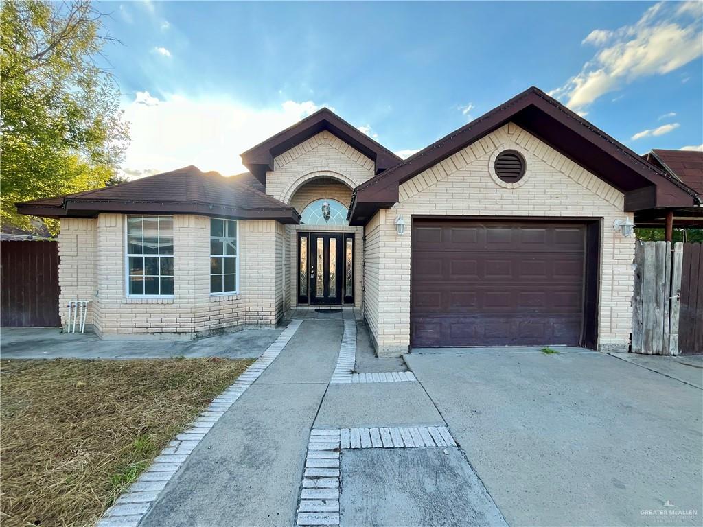 View of front of property with a garage