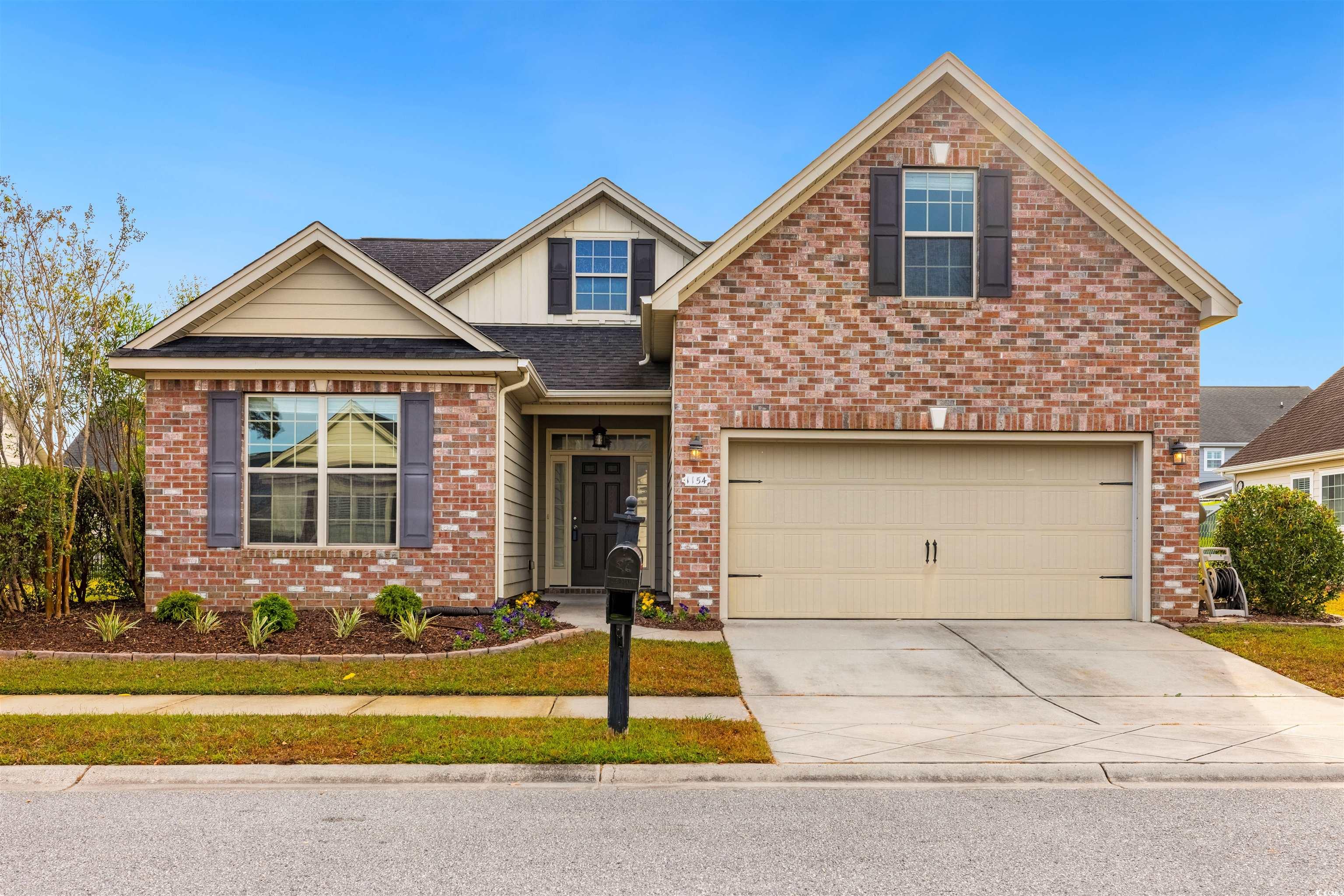 Front facade featuring a garage