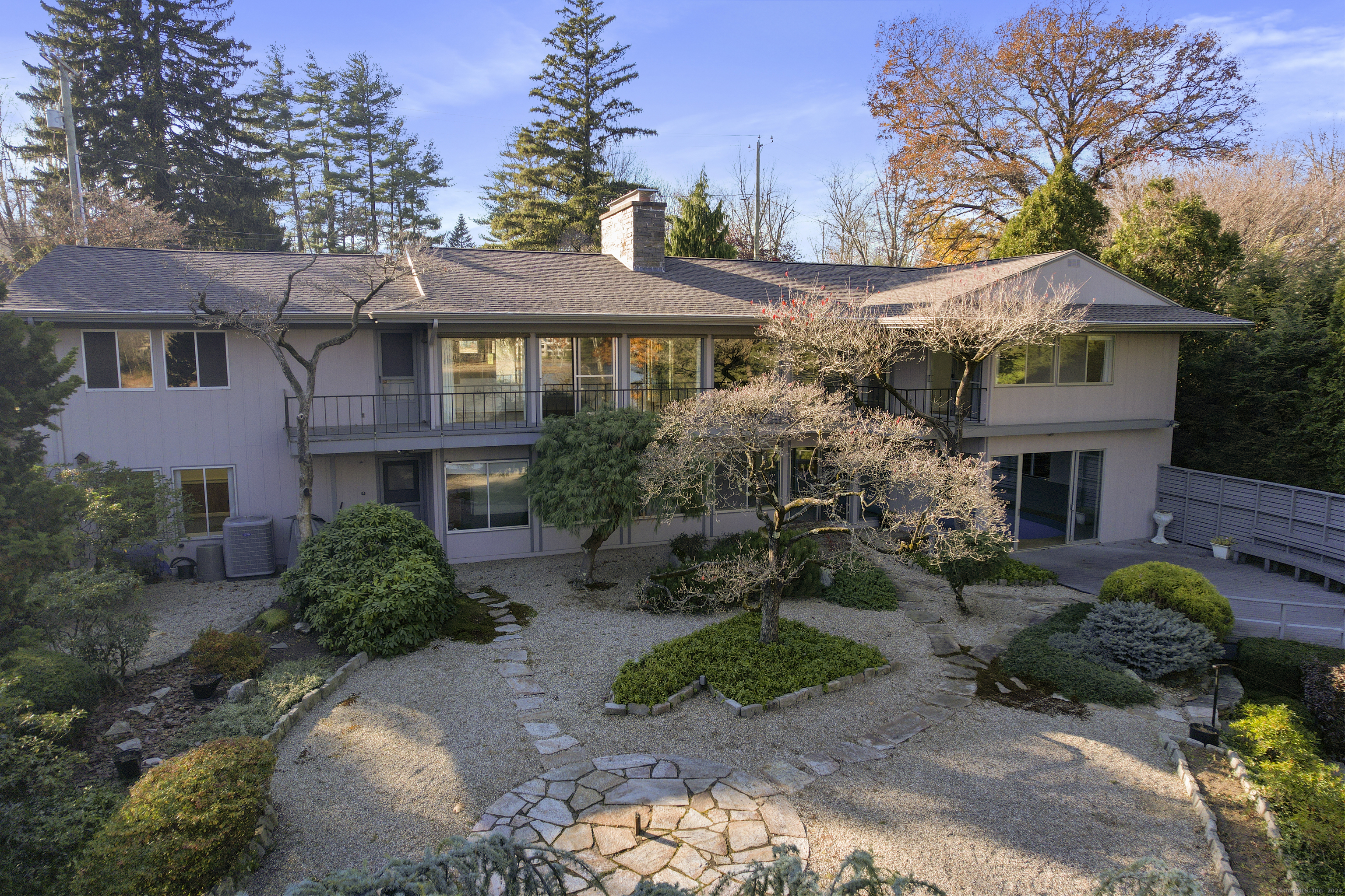 a front view of a house with garden