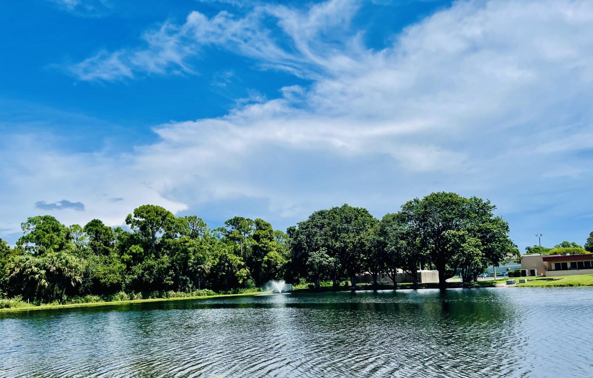 a view of lake with green space