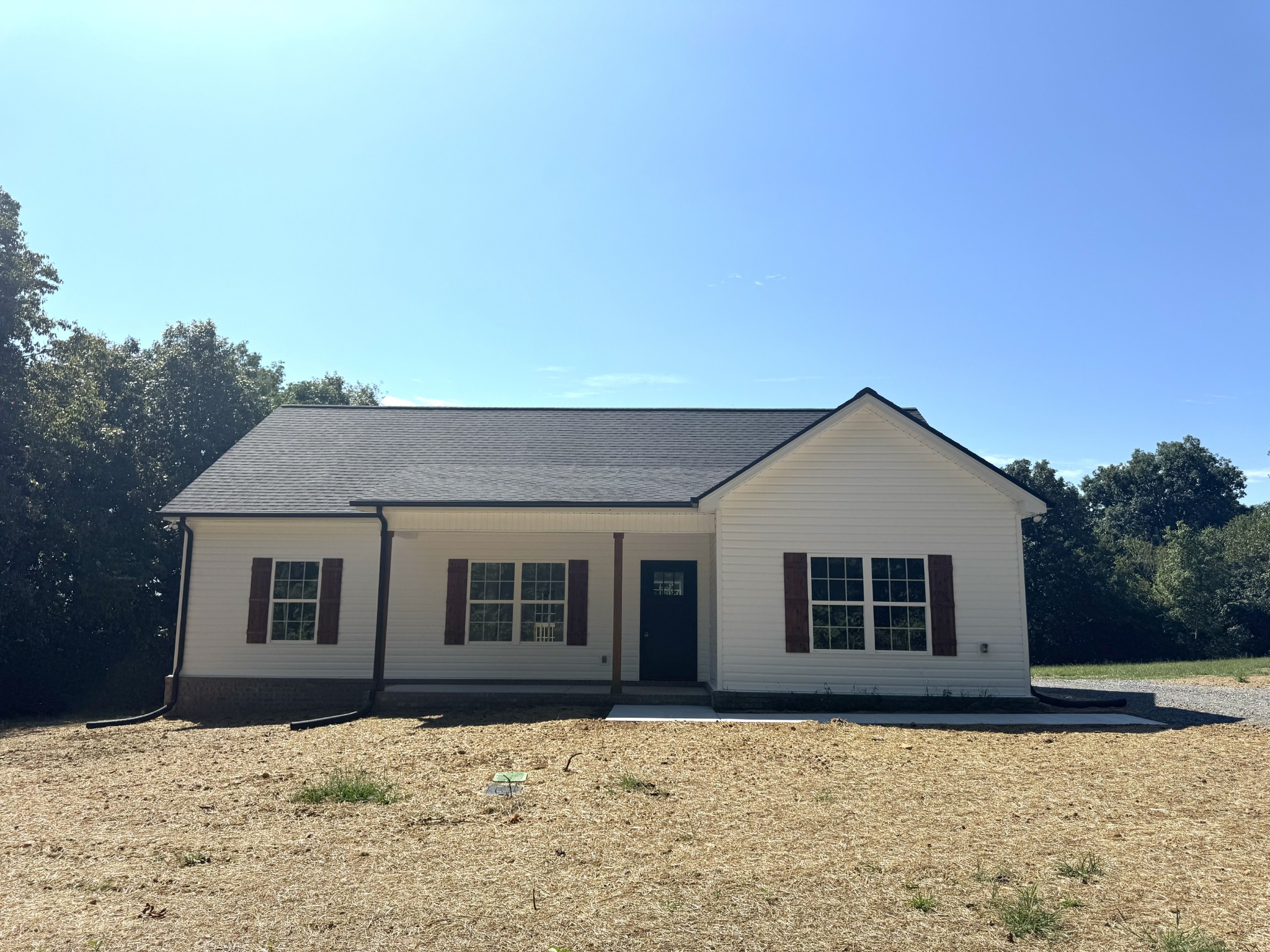 a front view of a house with a yard