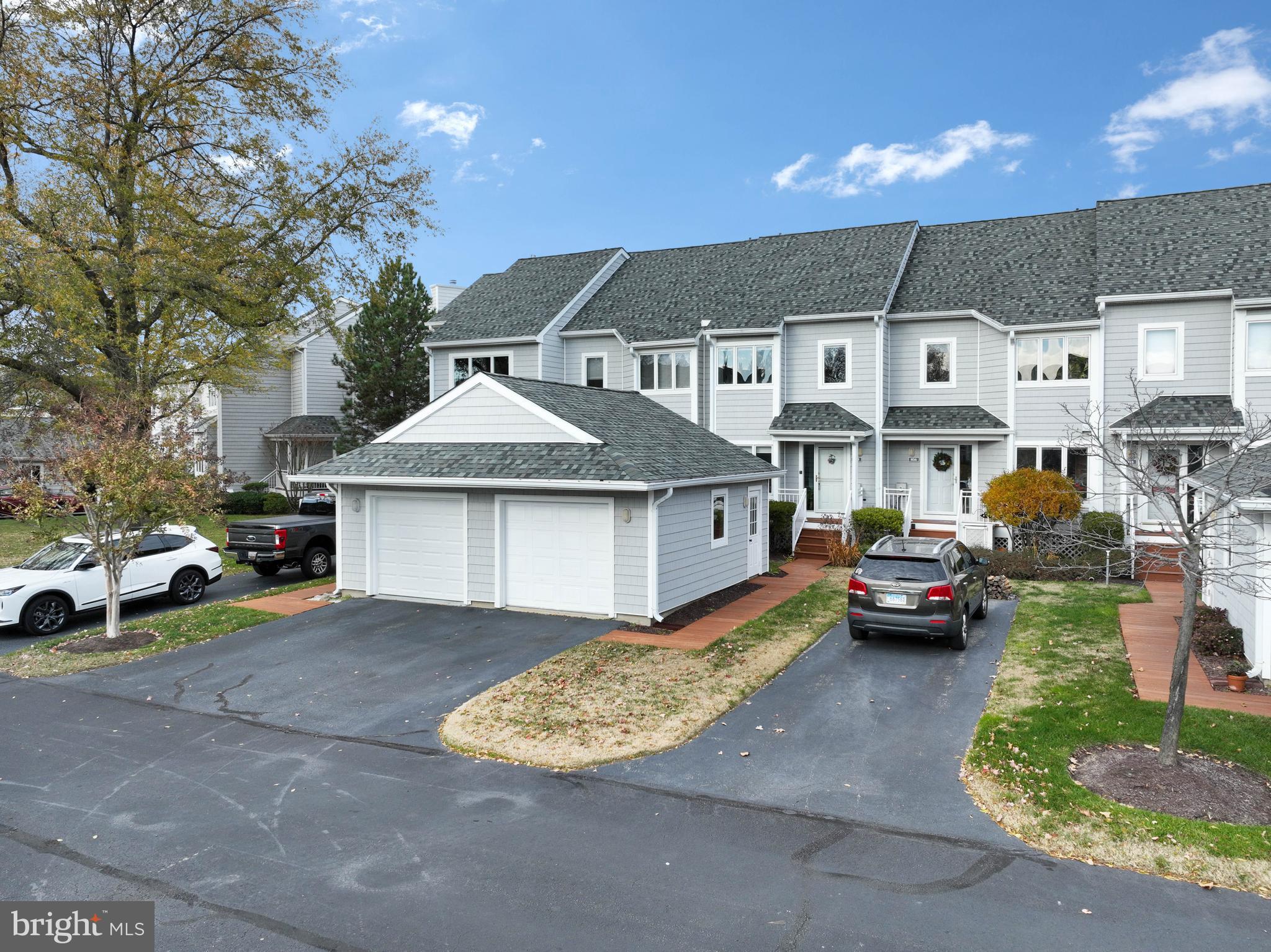 a view of multiple houses with a yard