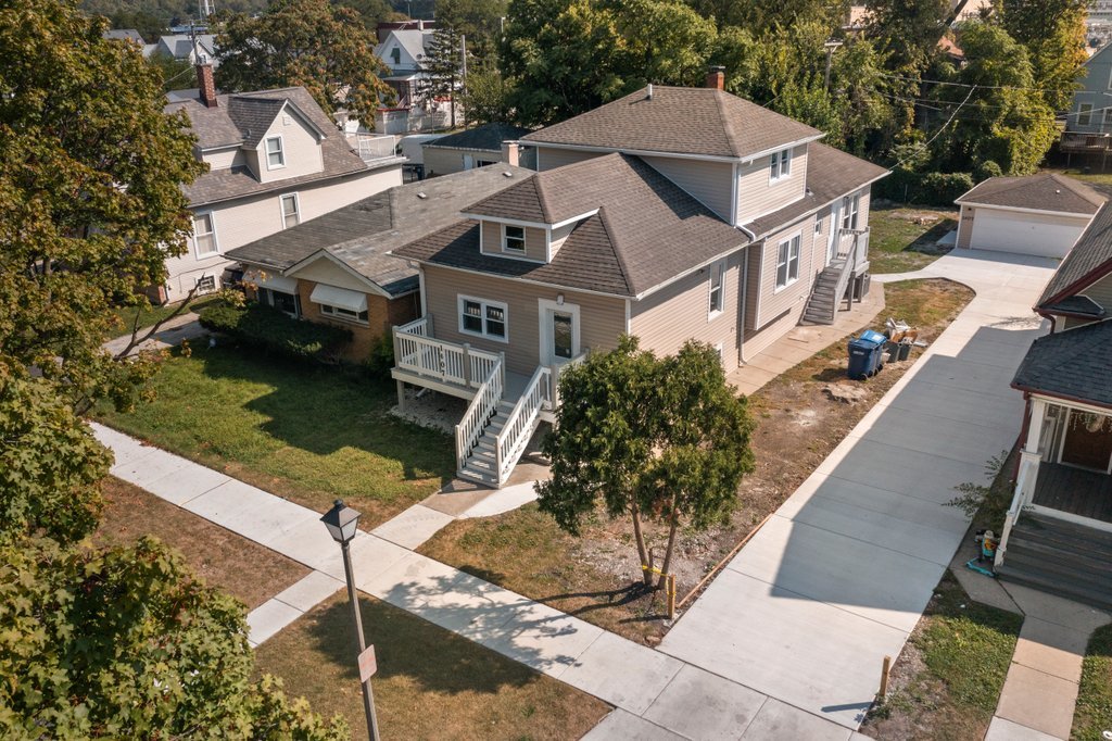 a aerial view of a house with a yard