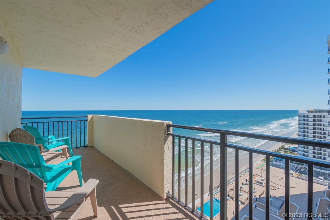 a view of a balcony with chairs