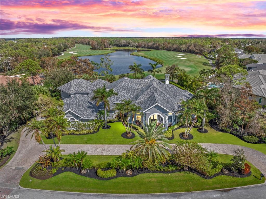 an aerial view of residential houses with outdoor space and garden