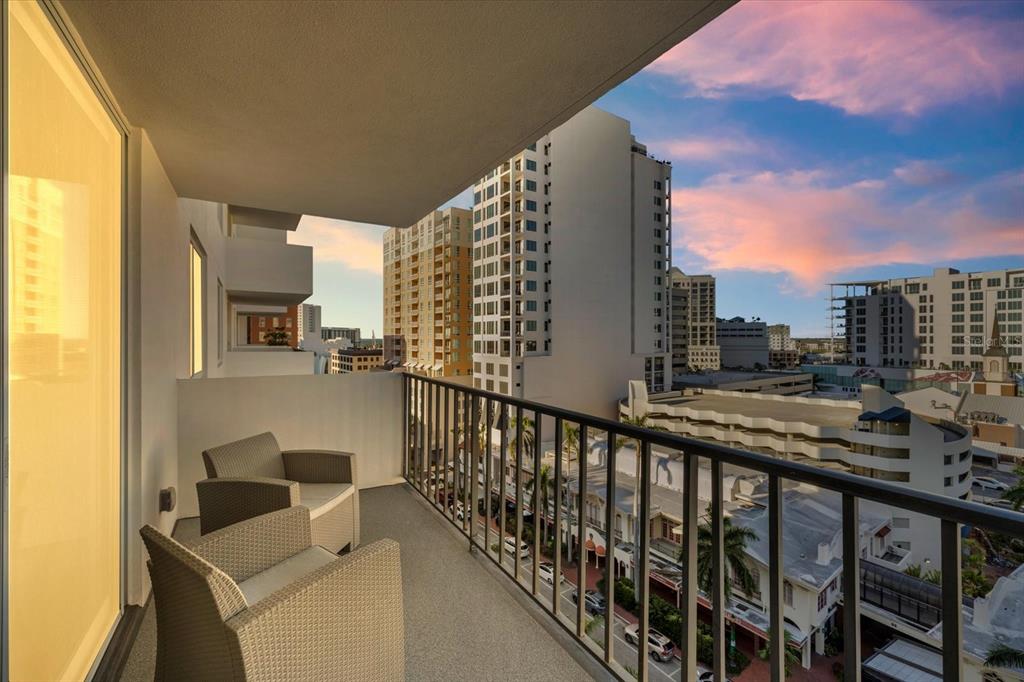 a view of balcony with furniture