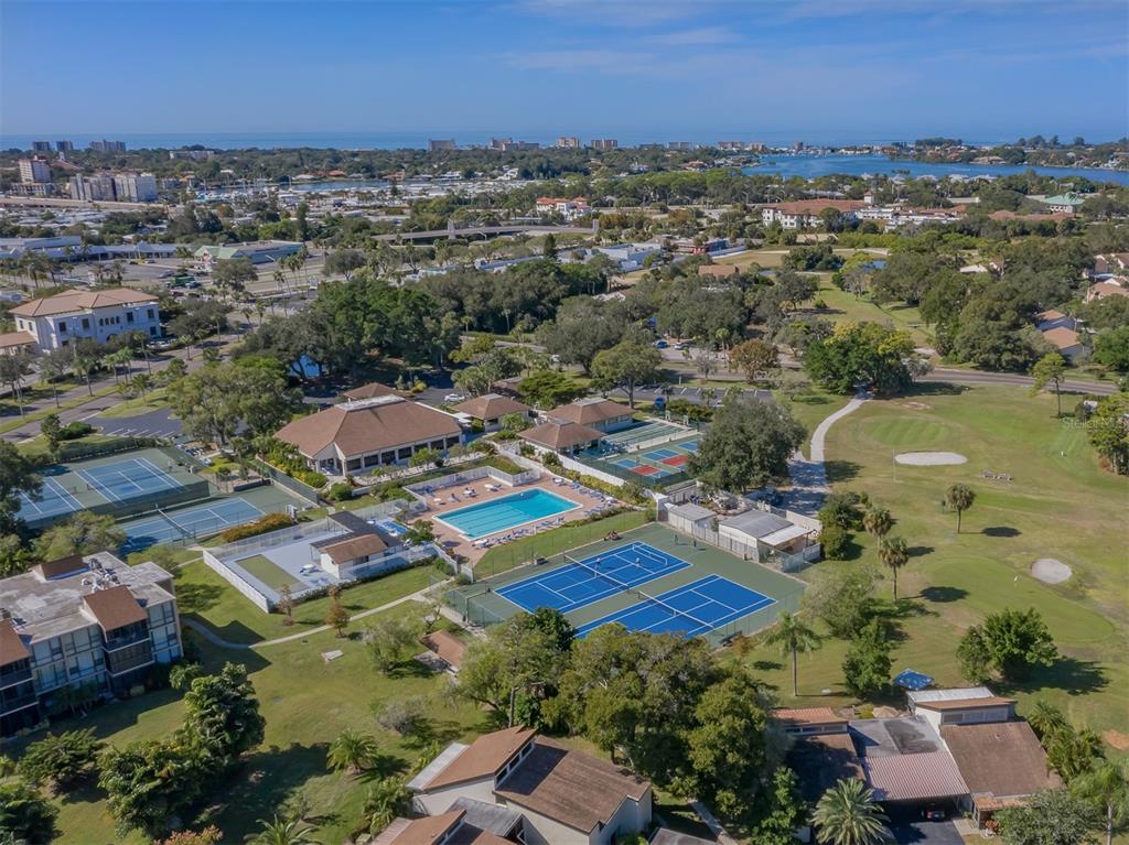 an aerial view of residential houses with outdoor space