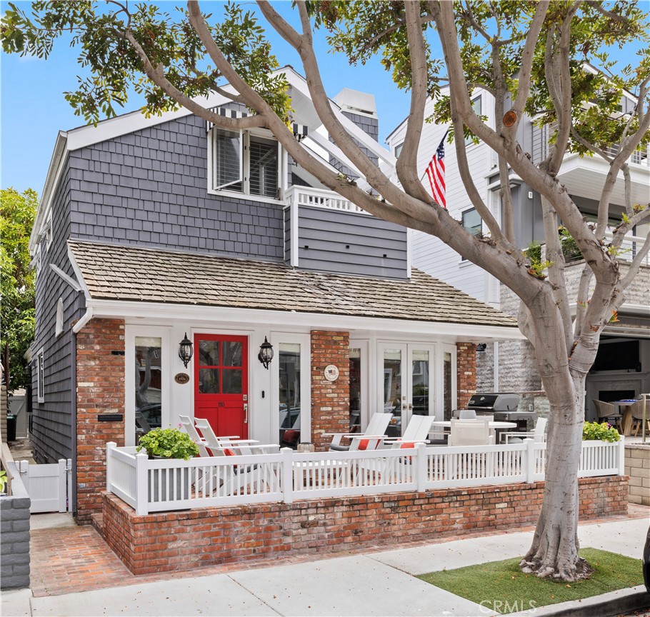 a front view of house with yard and outdoor seating