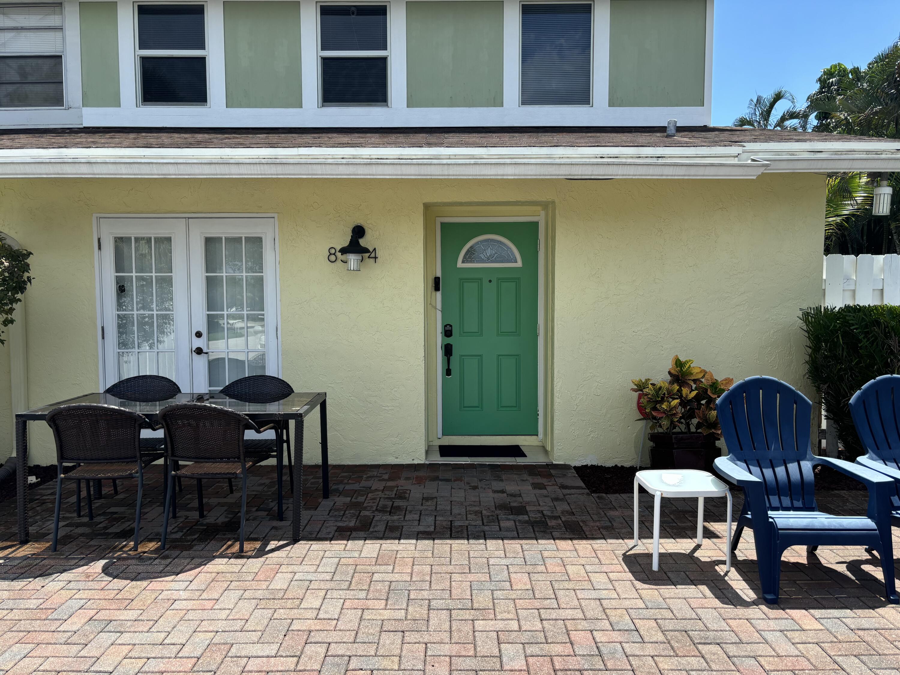 a view of a two chairs in the patio