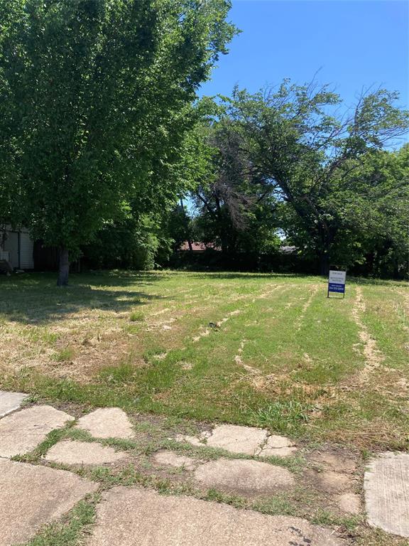 a view of a pool with a yard