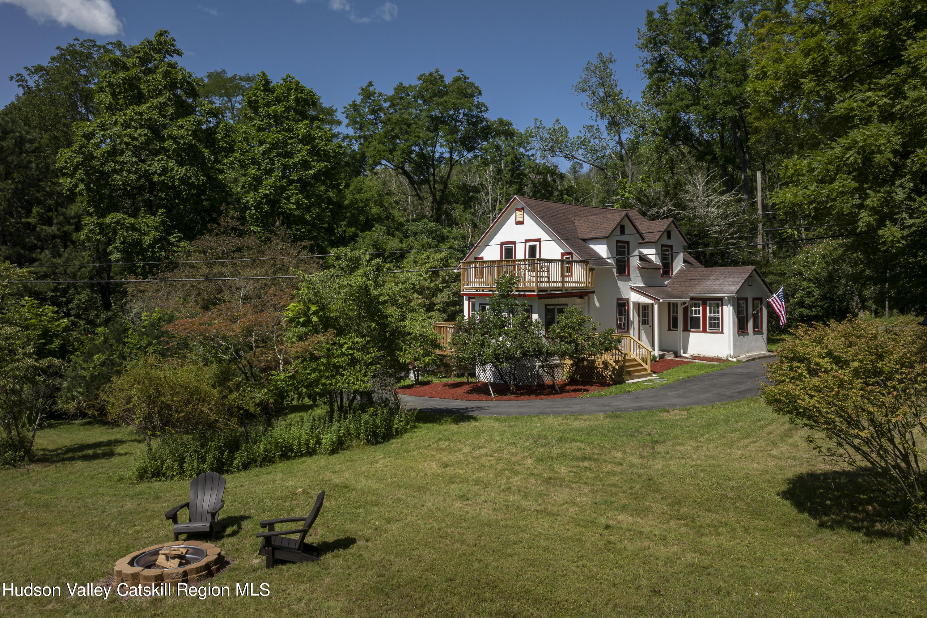 an aerial view of a house with garden space and street view