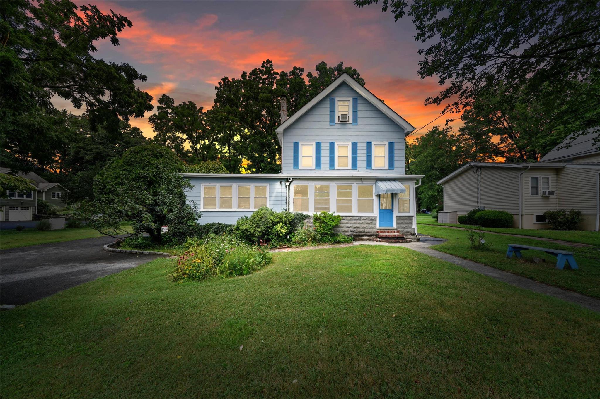 View of front of home featuring a lawn