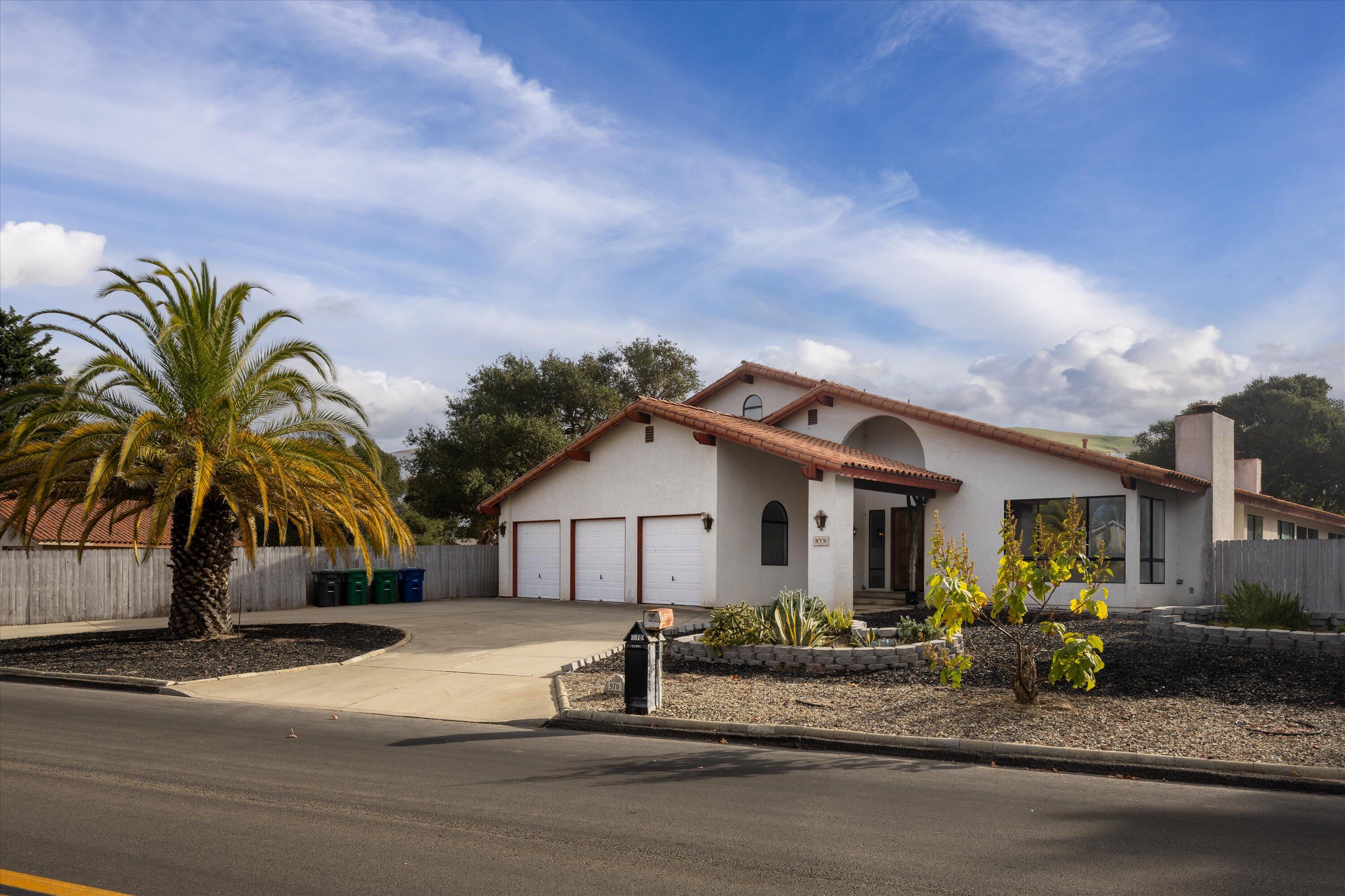 a view of house with entertaining space and a car parked in front of it