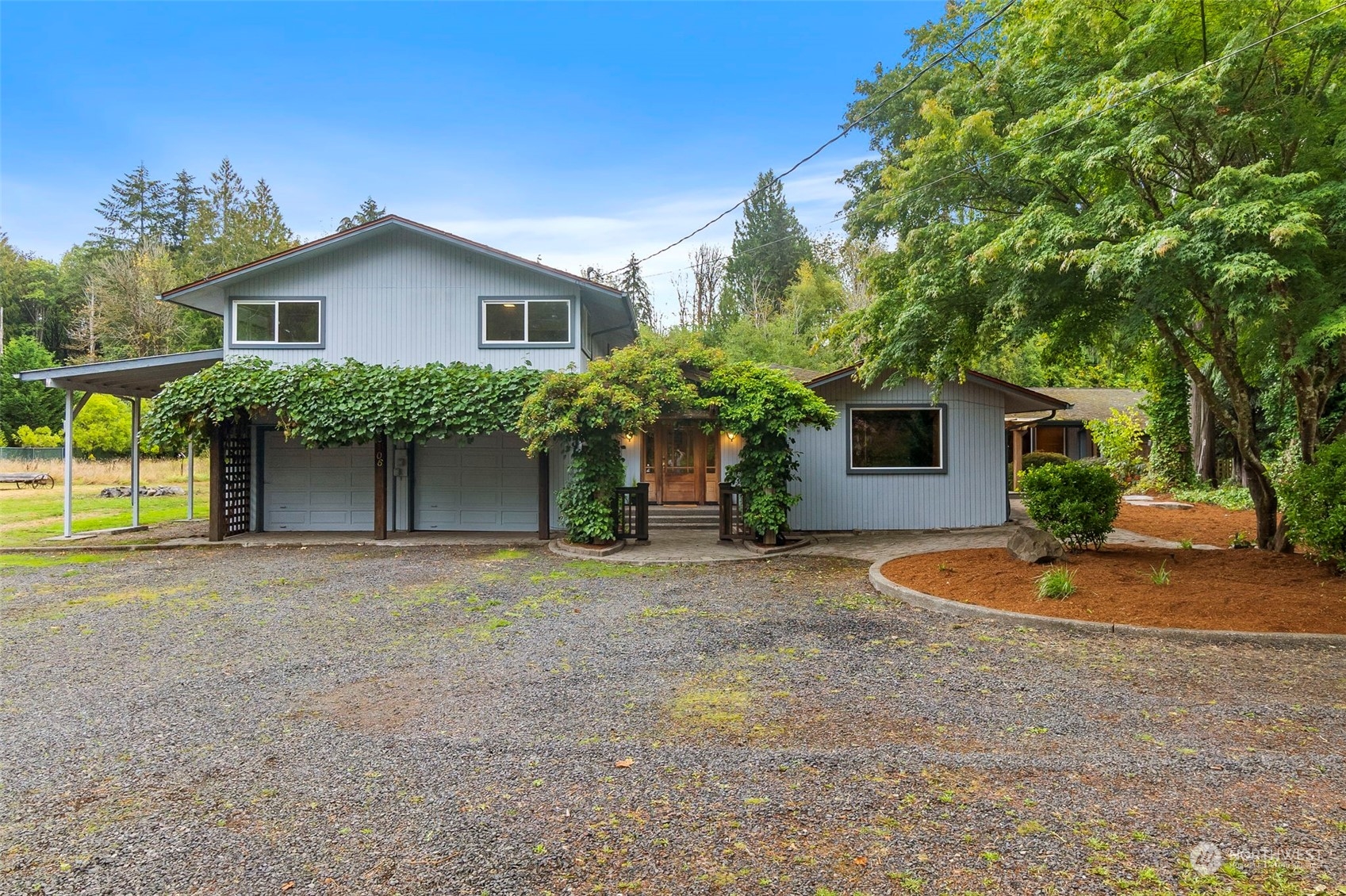 a front view of house with yard and trees