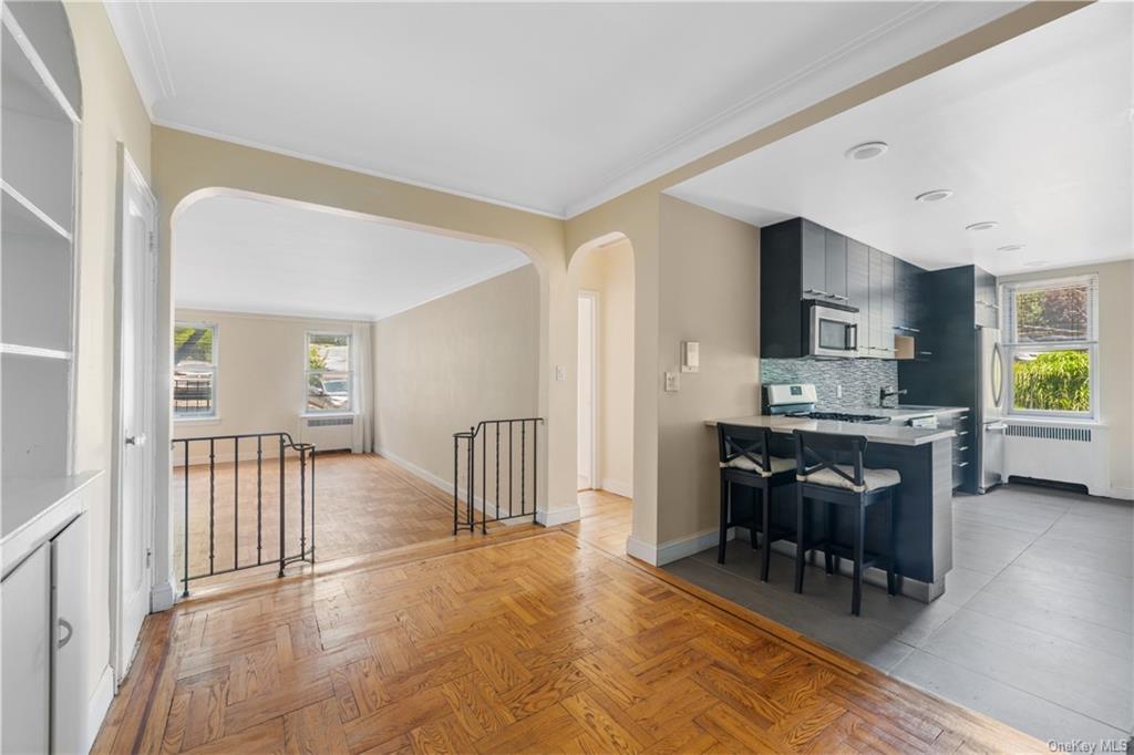 a view of a dining room kitchen with furniture and chandelier