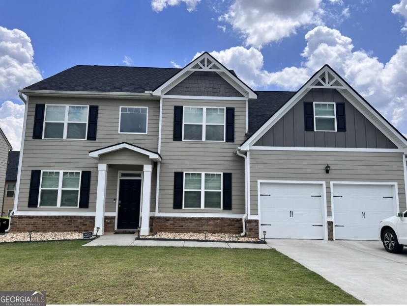 a front view of a house with a yard