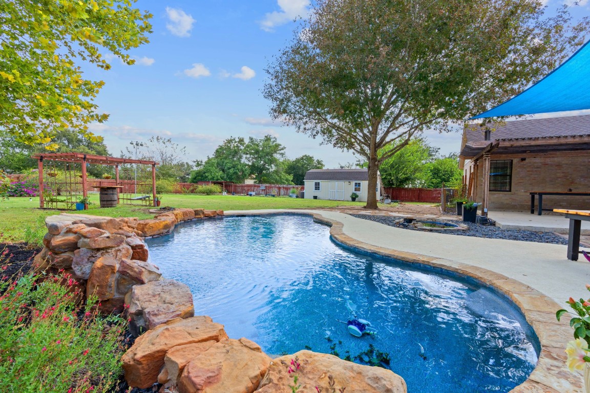 a view of a swimming pool with a patio