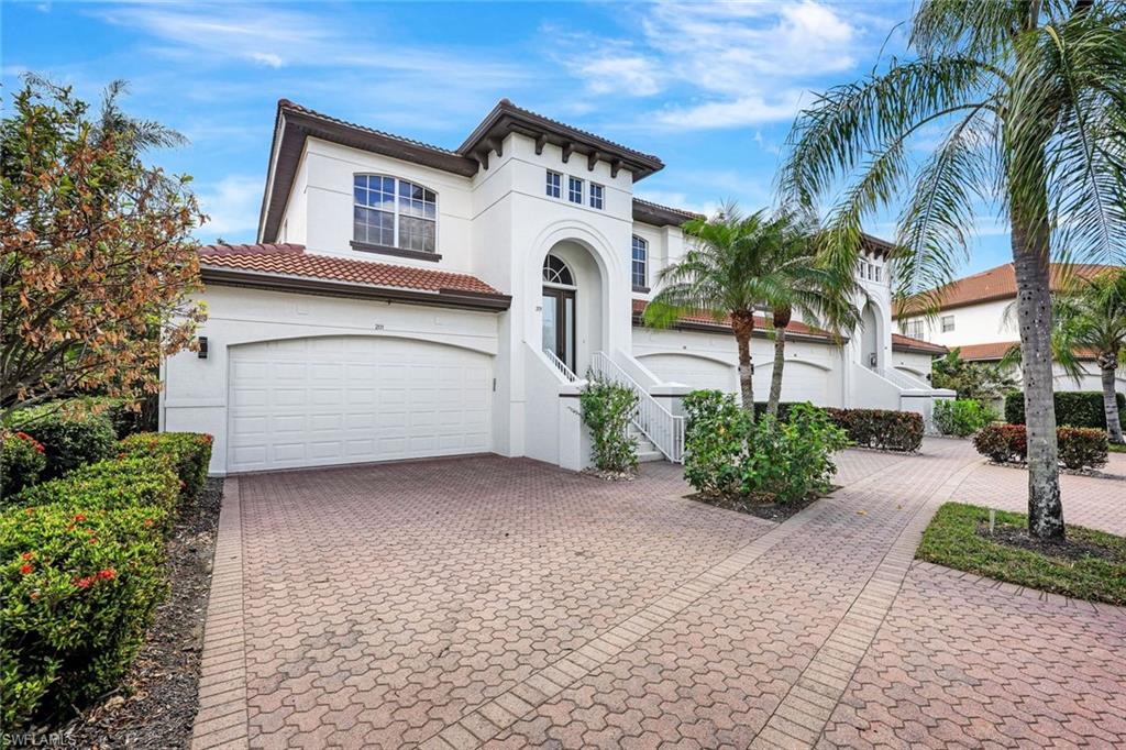 Mediterranean / spanish-style home featuring a garage