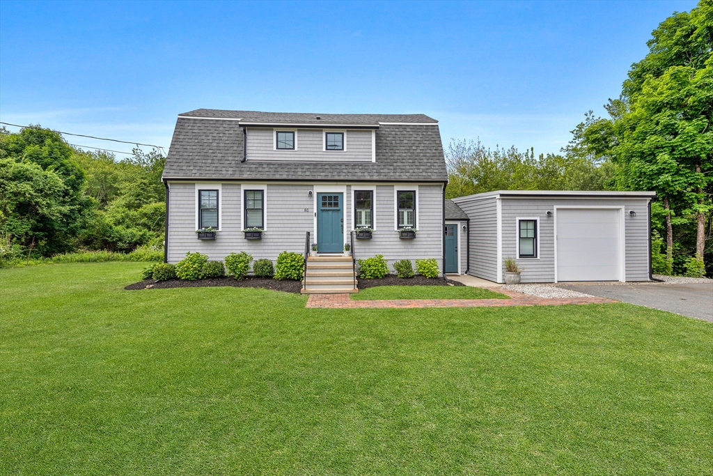 front view of a house with a yard