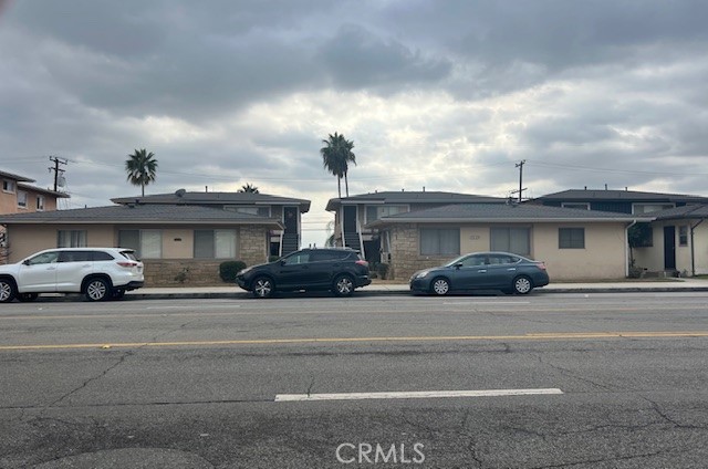 a view of a cars in front of a building