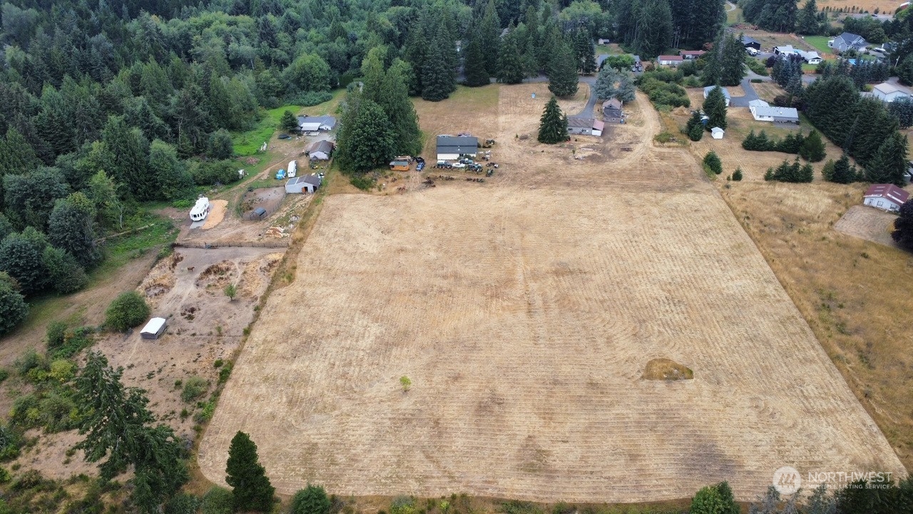 a view of a backyard of the house