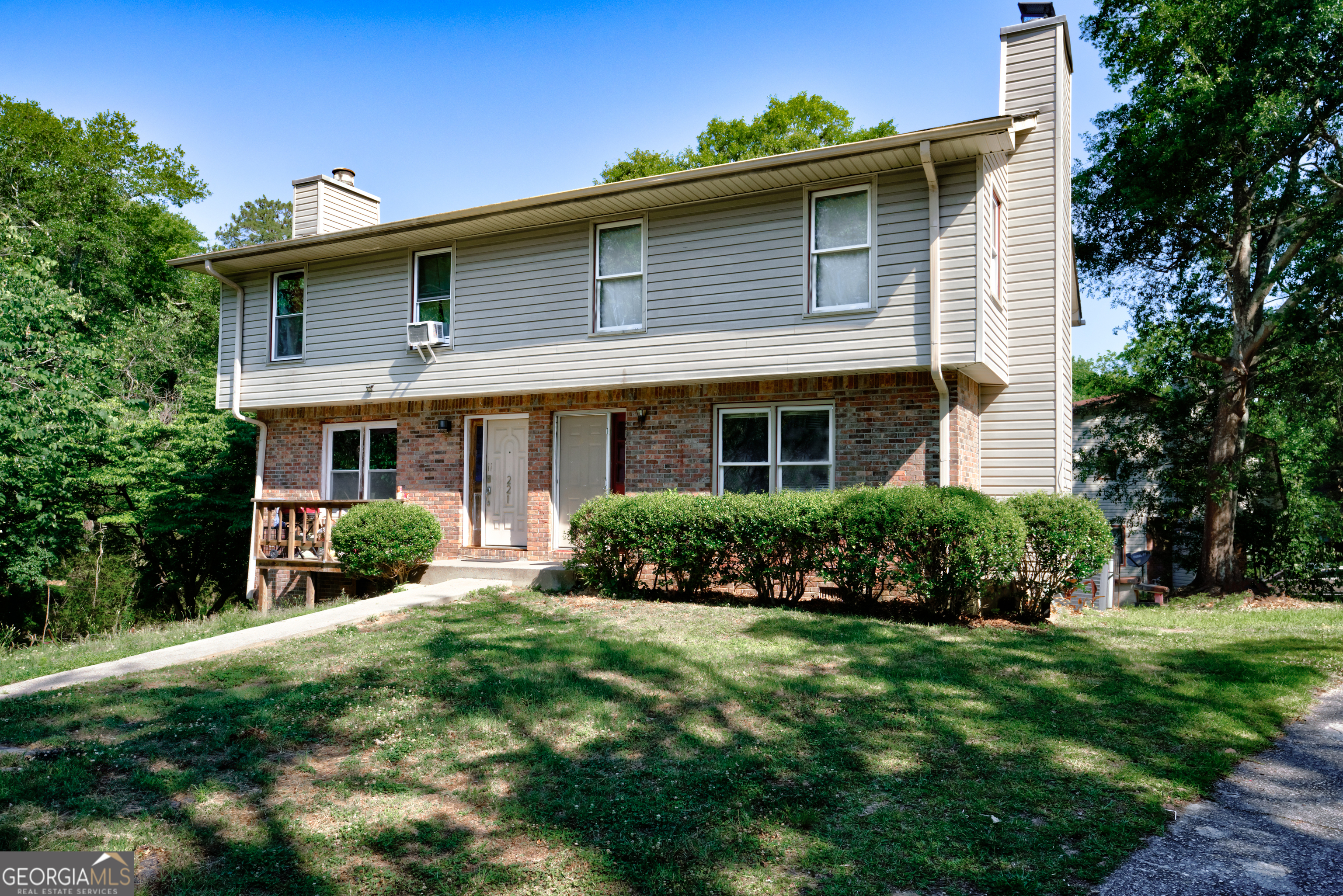 a front view of a house with a yard