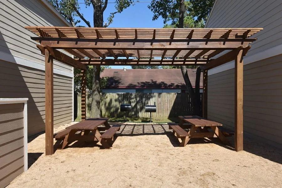 a view of a chairs and table in the patio