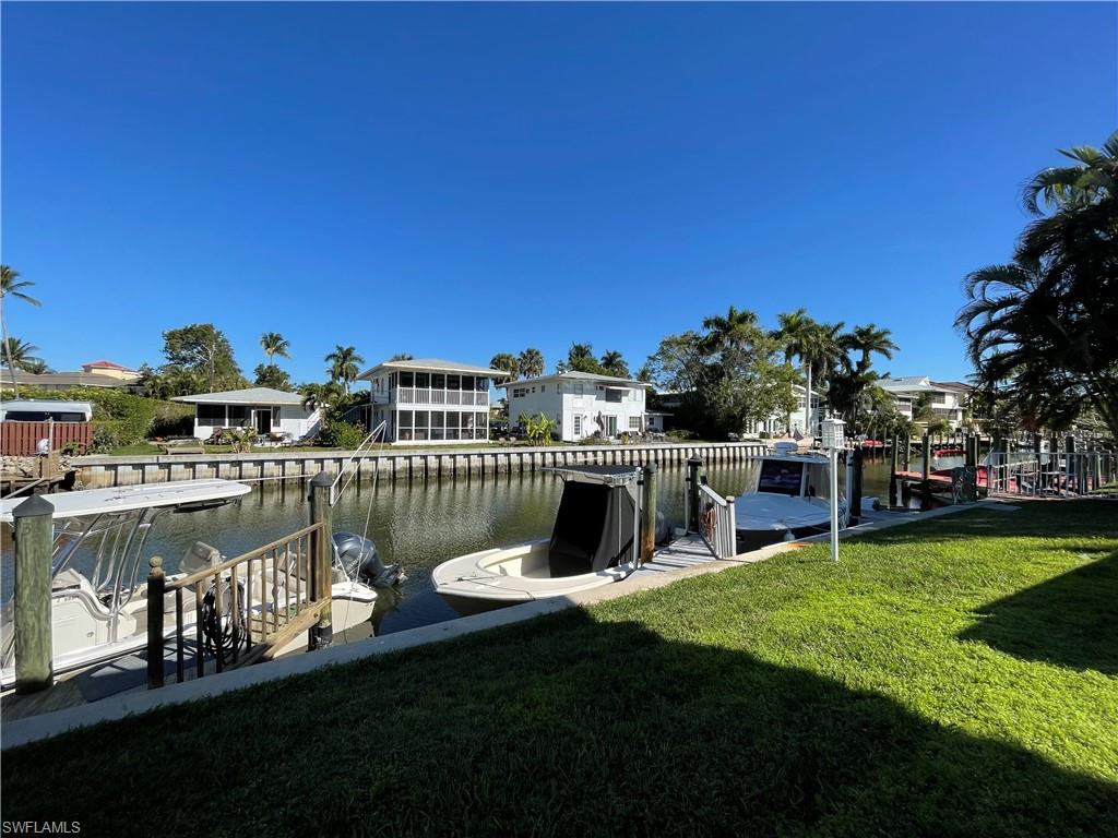 a view of a lake with a house in the background