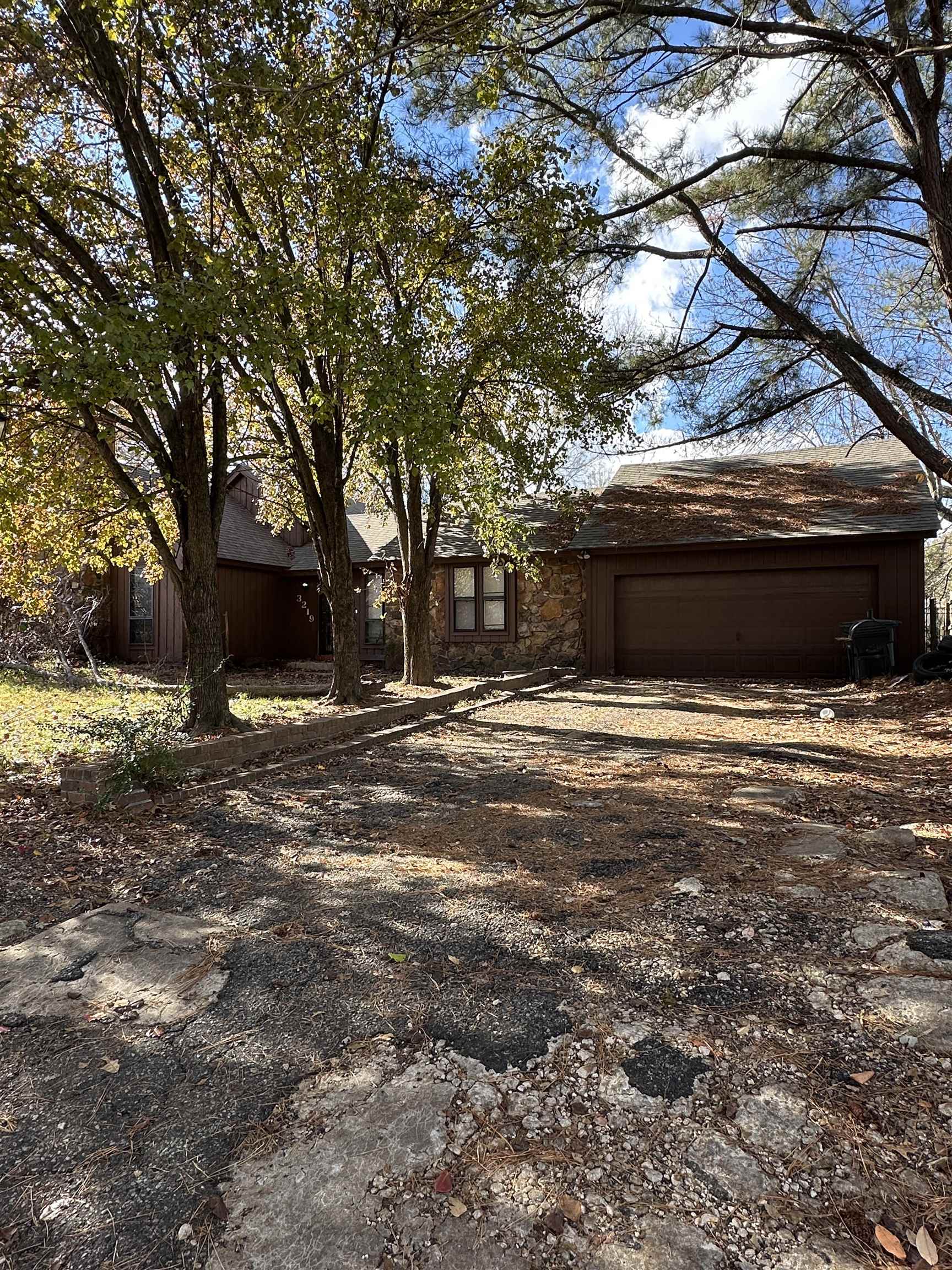 a view of house with backyard space