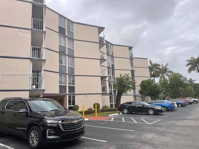 a view of parking with cars parked