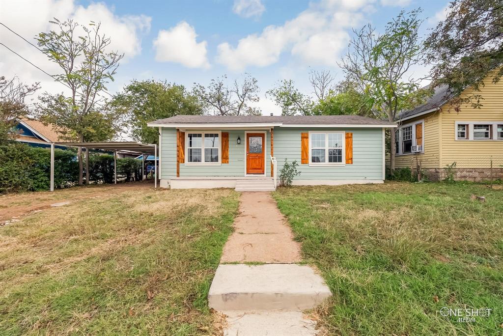 front view of a house with a yard