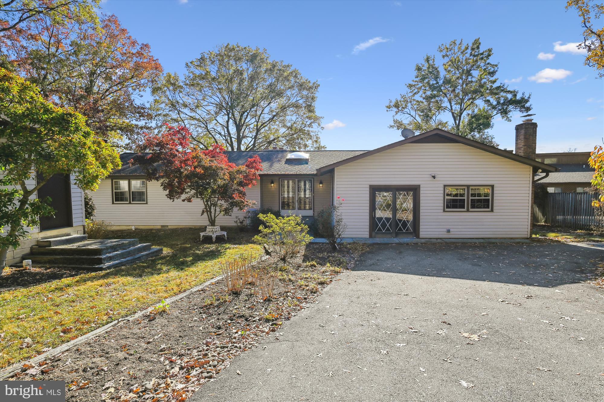 a view of a yard with a house in the background