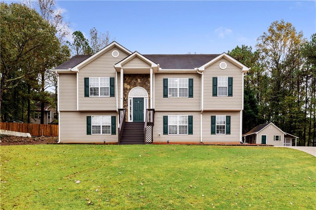 a front view of a house with a yard