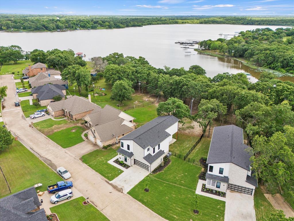 an aerial view of a house with a lake view