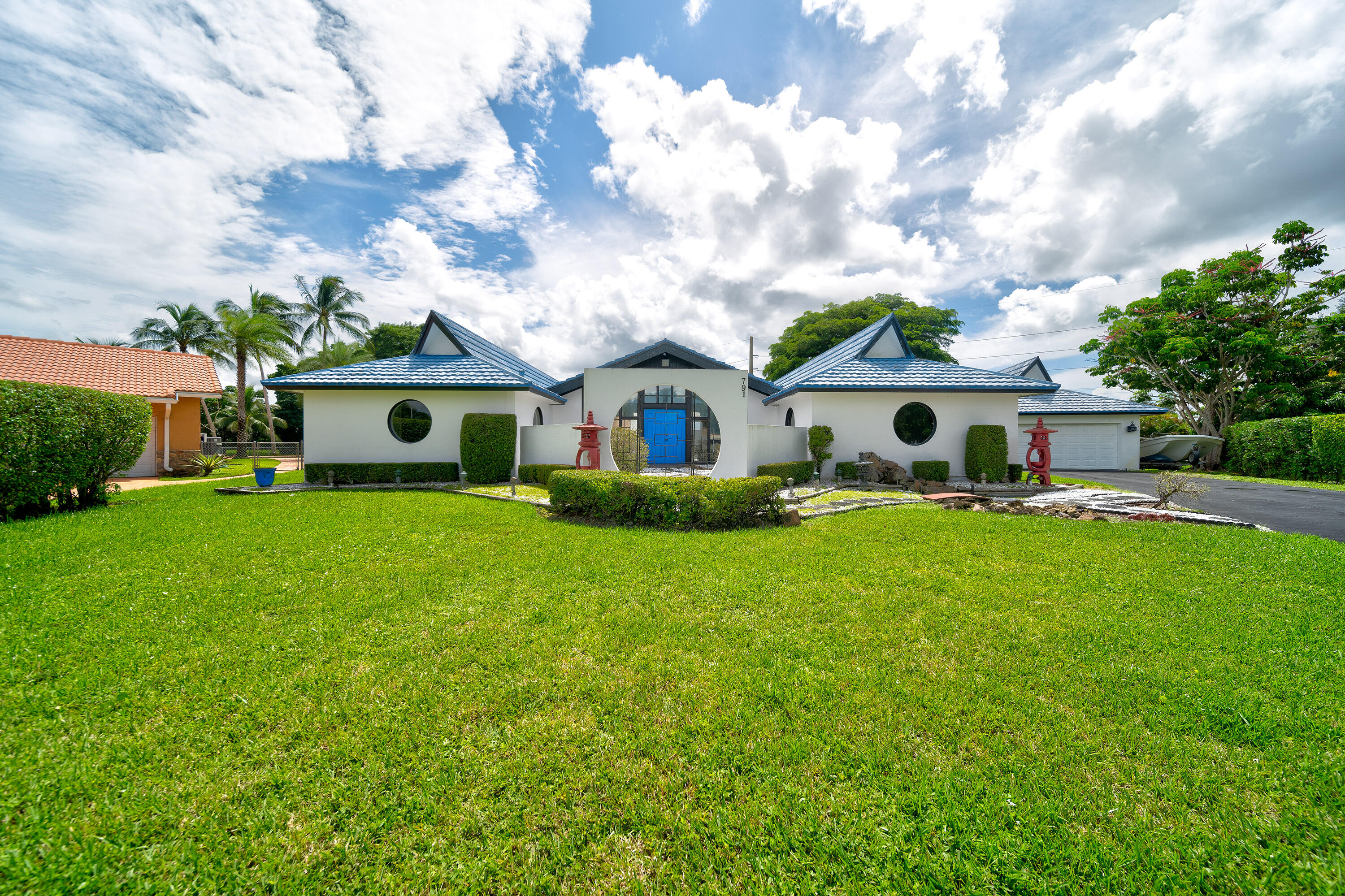 a front view of a house with garden