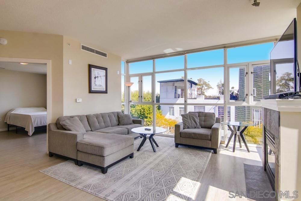 a living room with furniture and a large window