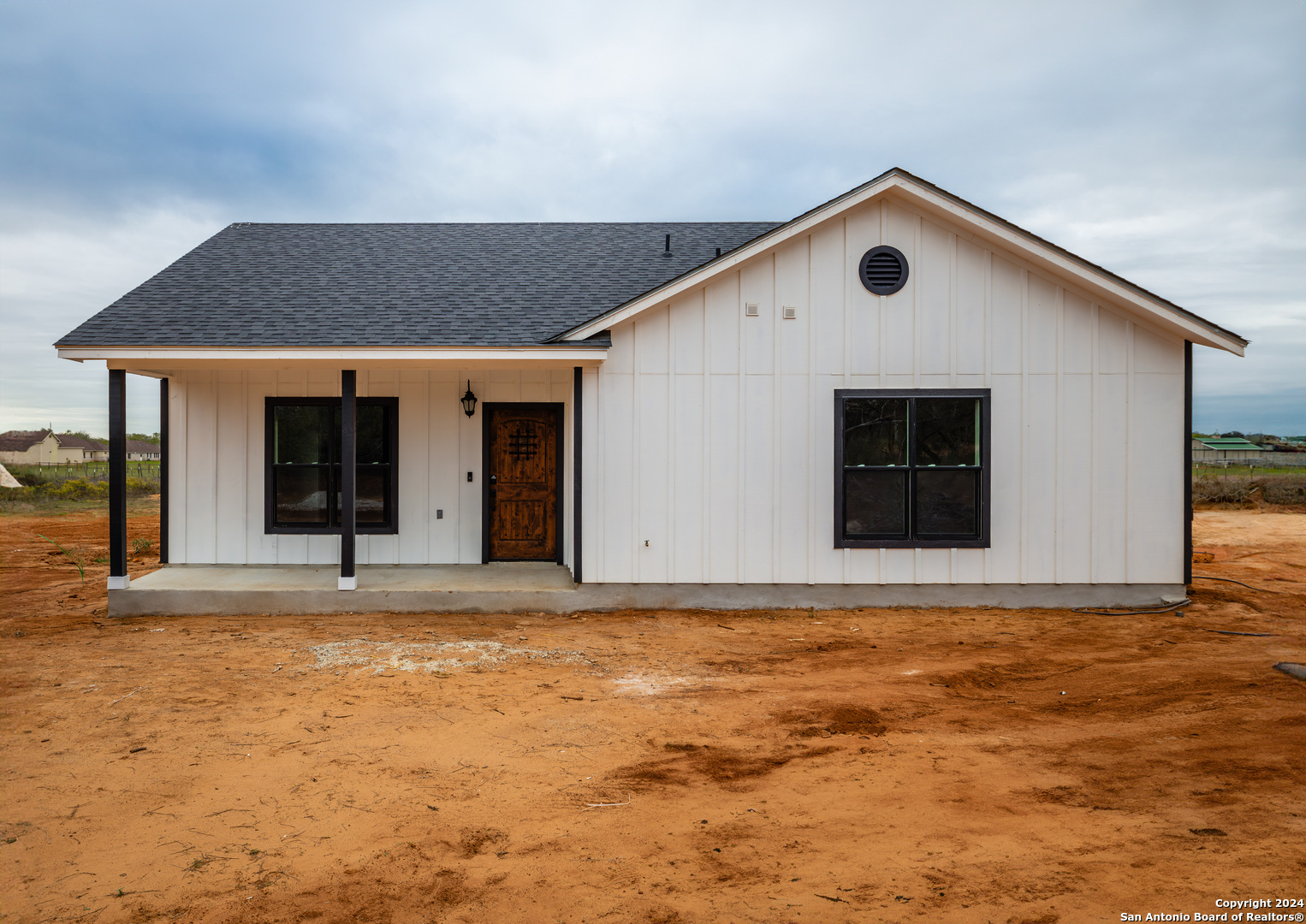 a front view of the house with a yard