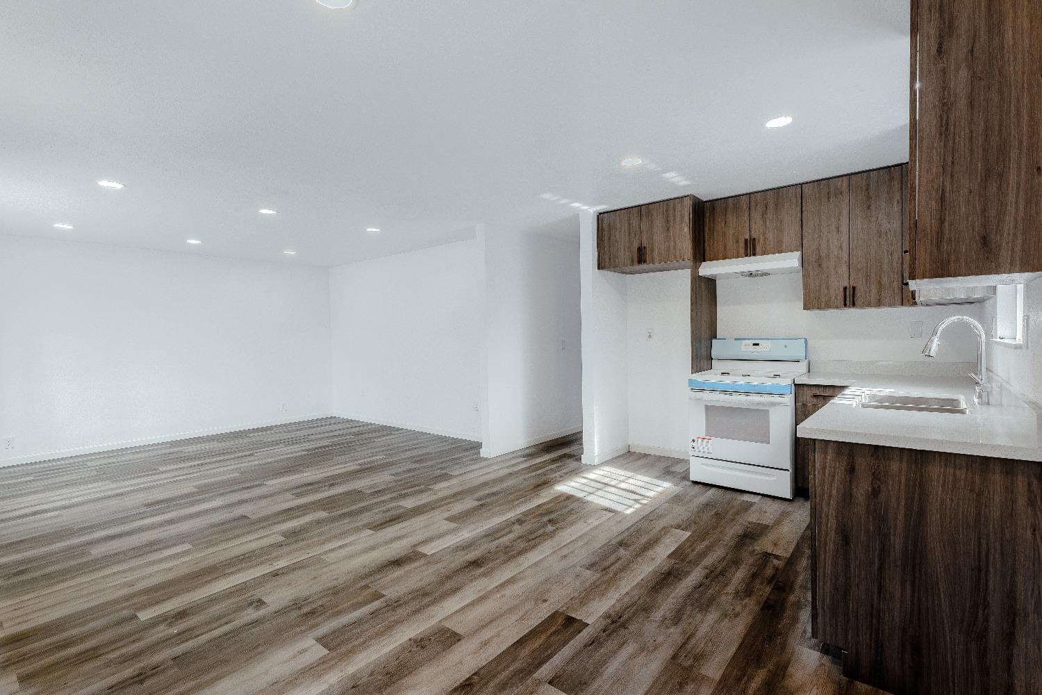 a view of kitchen with wooden floor