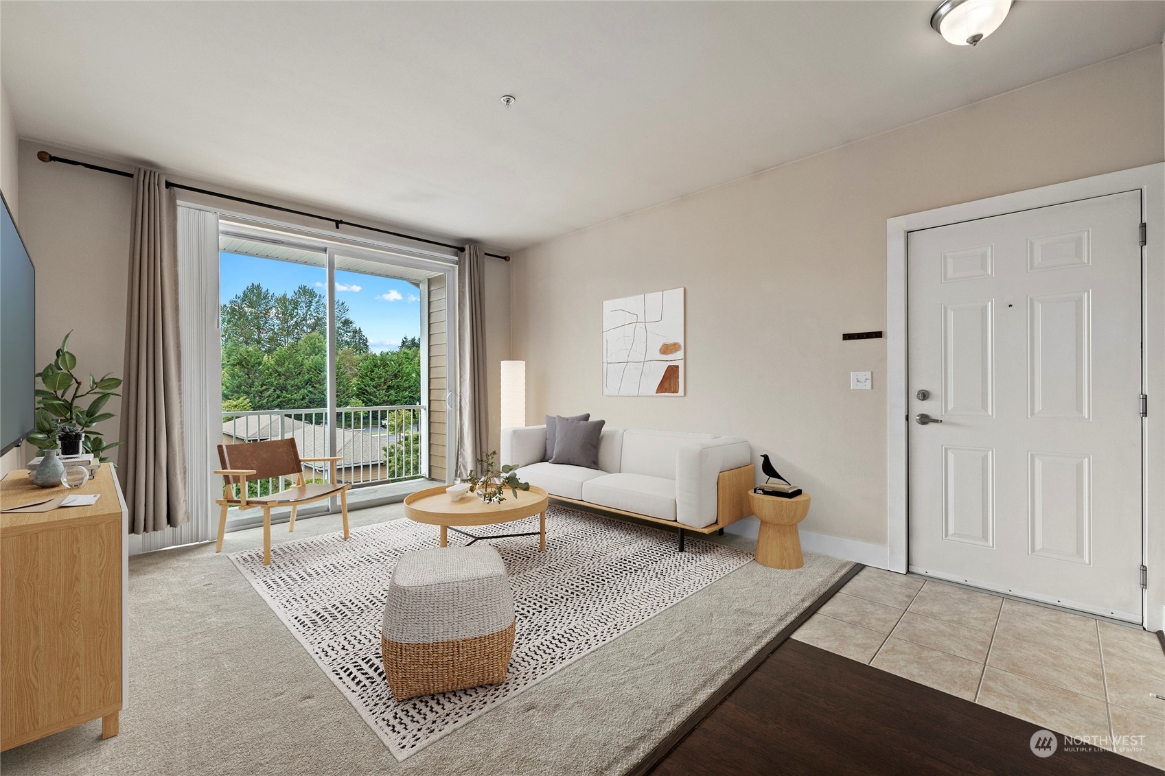 a living room with furniture and a large window