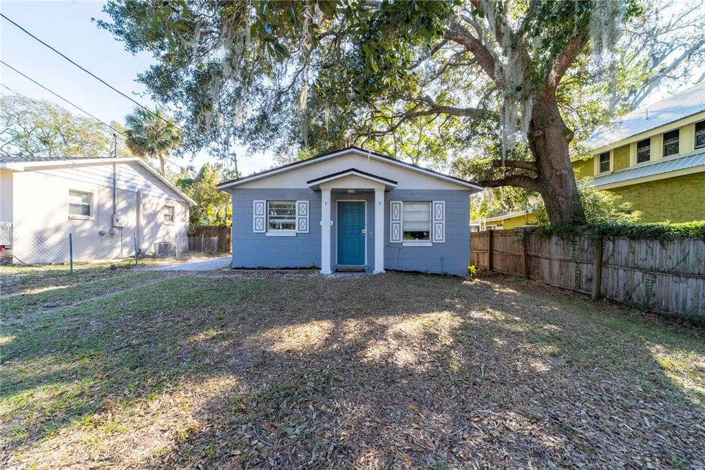 a view of a house with a yard