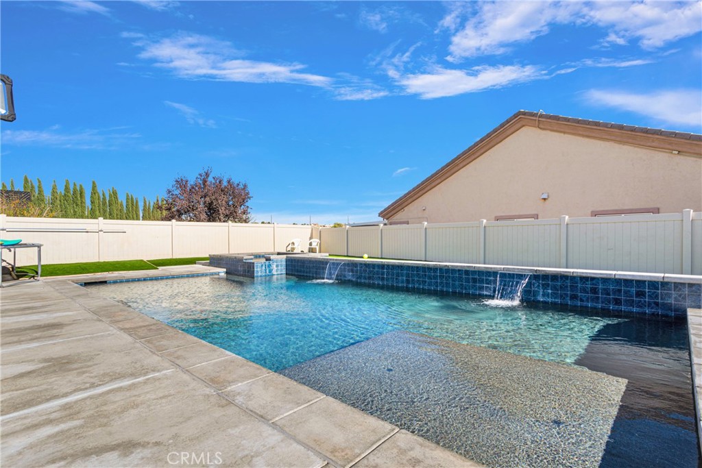 a view of a back yard with an outdoor space