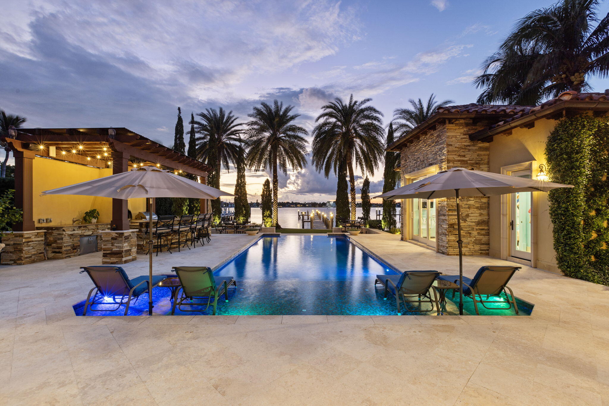 an outdoor space with pool and furniture