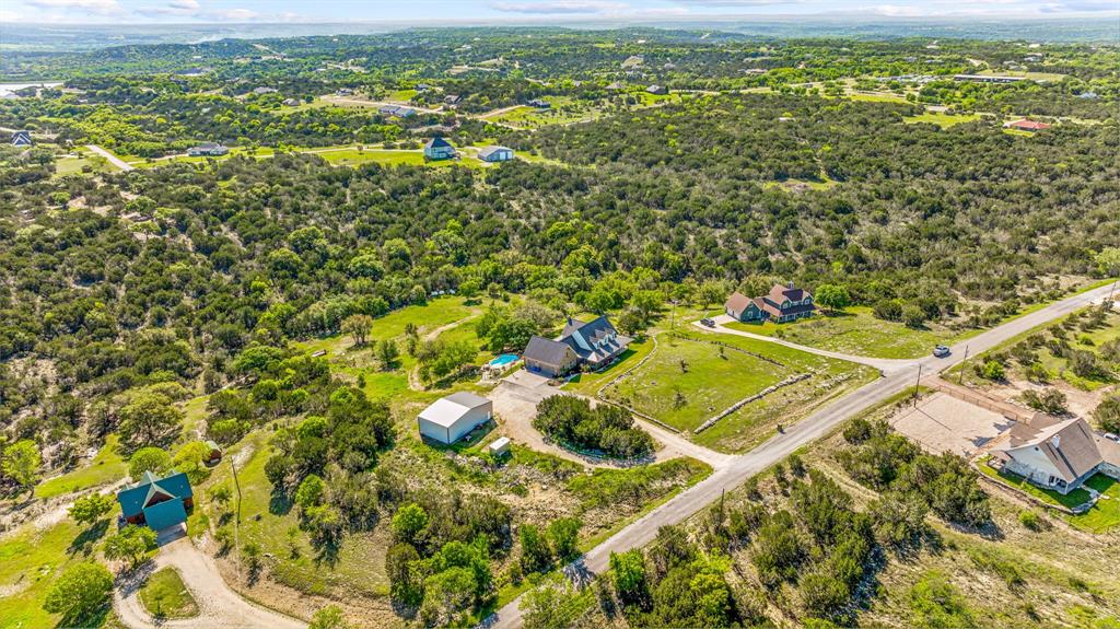 an aerial view of residential houses with outdoor space