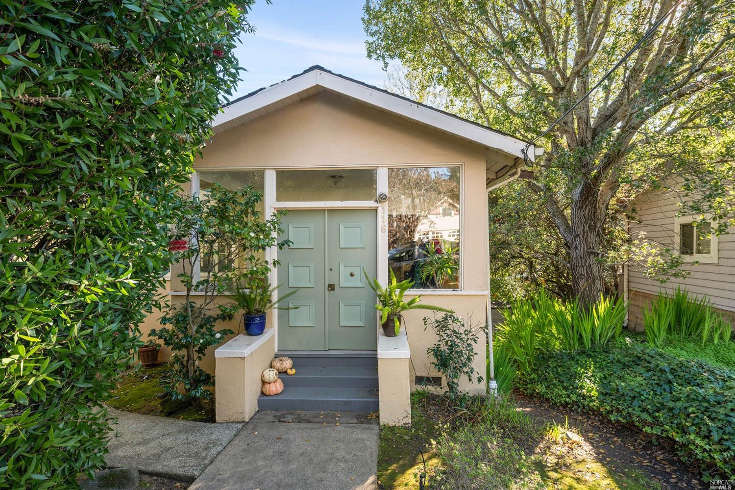 a front view of a house with a yard