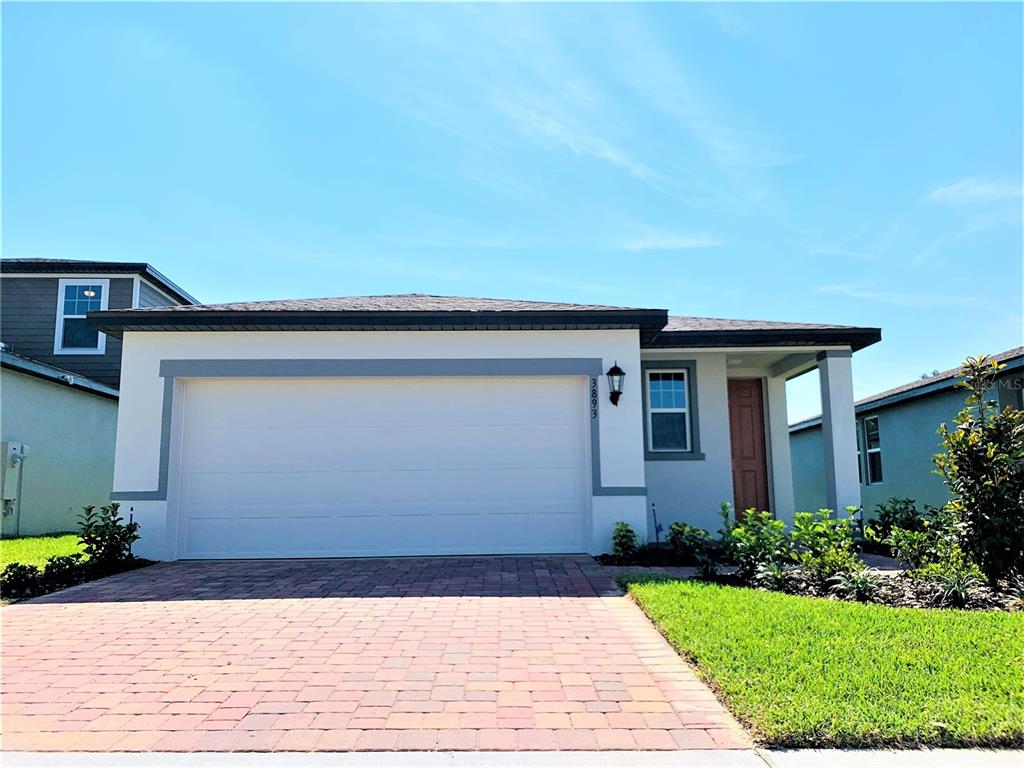 front view of a house with a yard