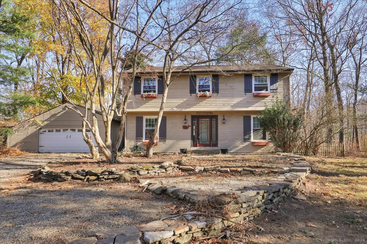 a front view of a house with yard