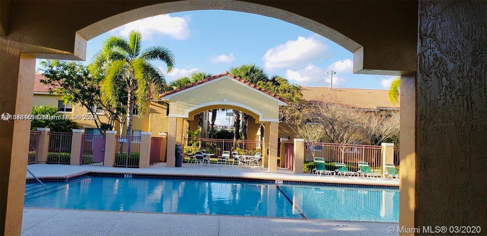 a view of swimming pool with a outdoor seating