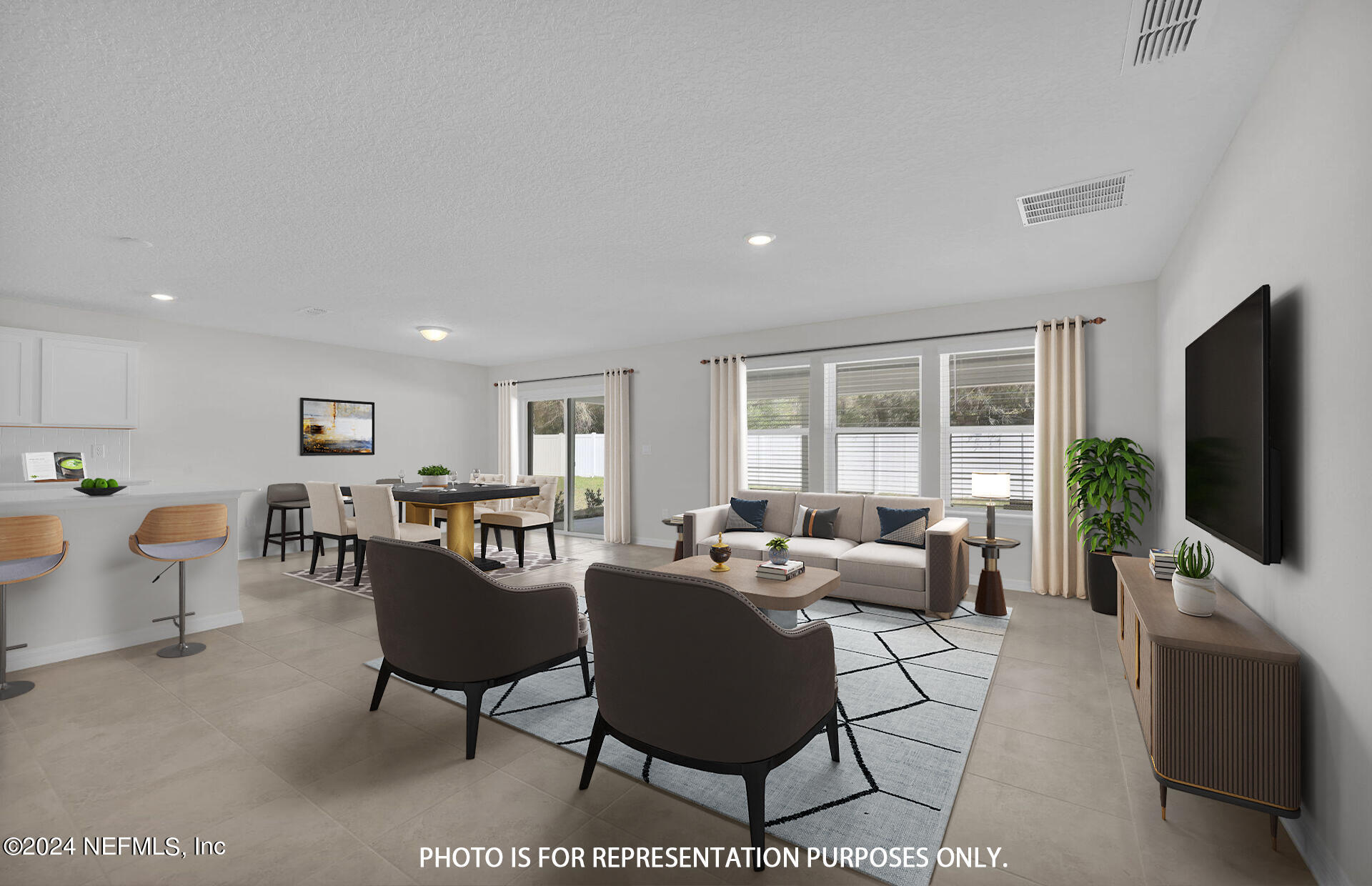 a living room with furniture a flat screen tv and large window