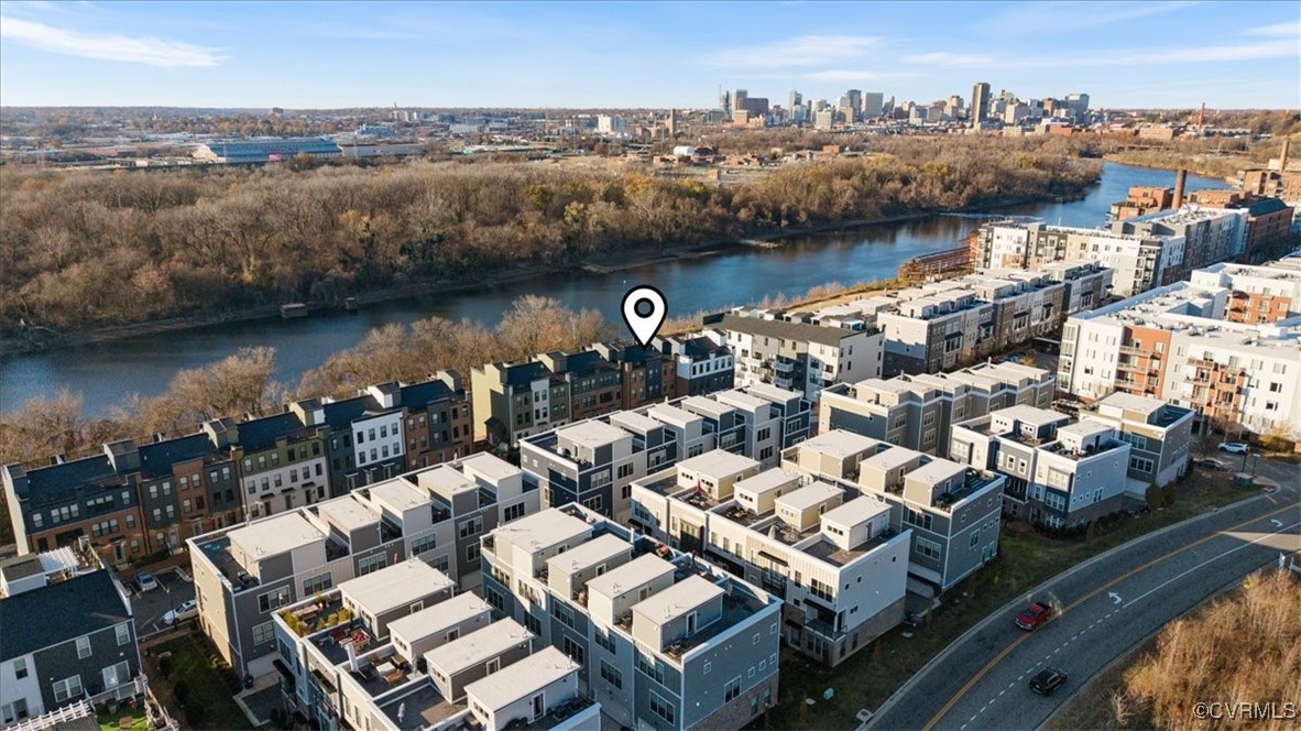 an aerial view of a house with a lake view